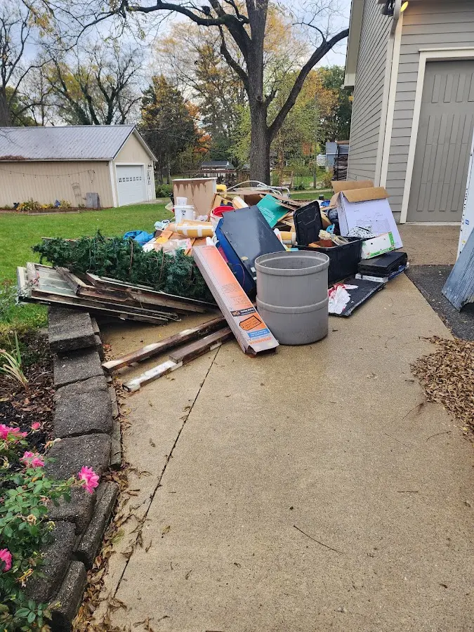 Dumpster being loaded with debris for Demolition Dumpster Rental in Newport